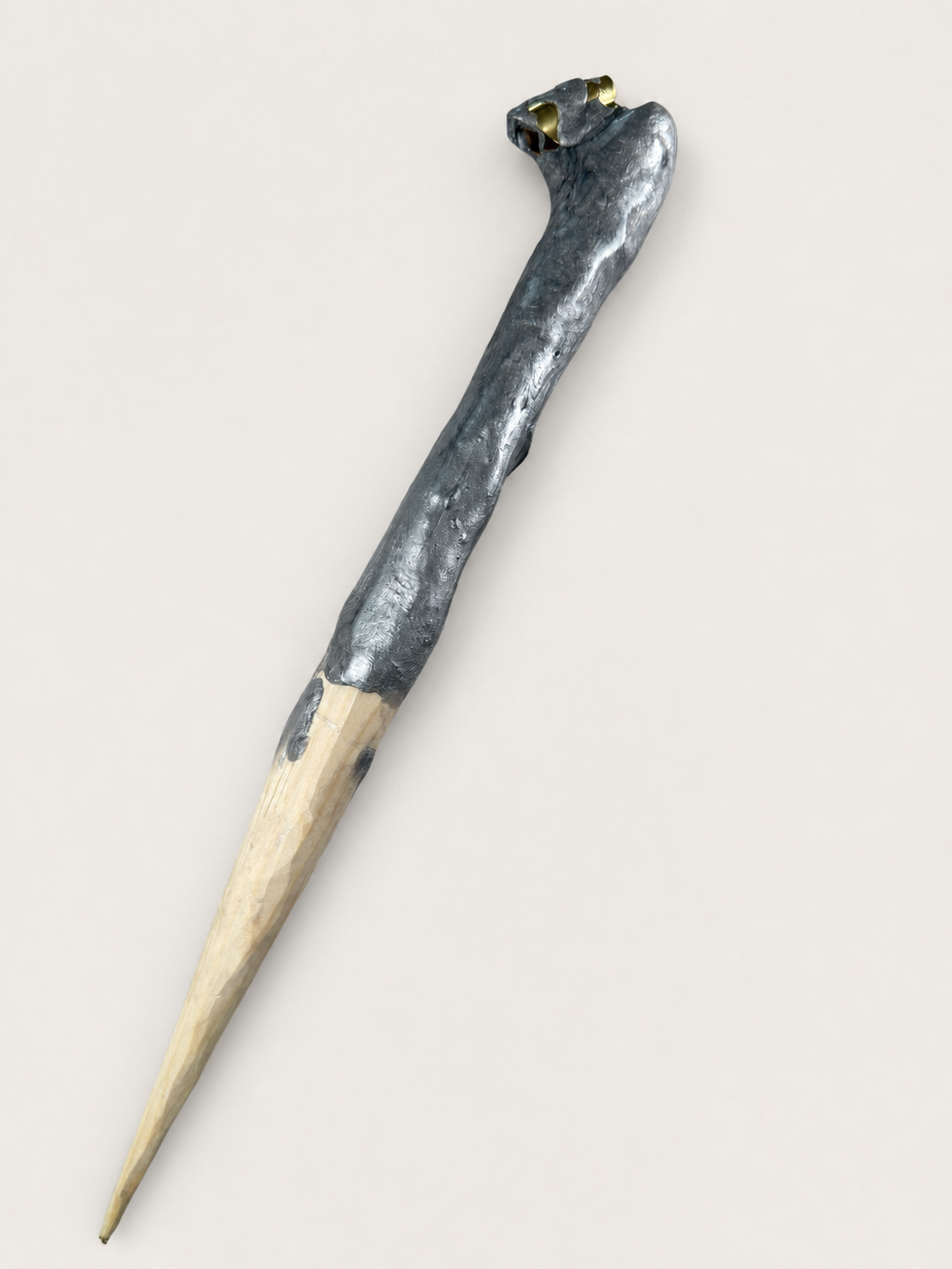 Full view of a hybrid wood and sculpted-head oblique holder prototype
