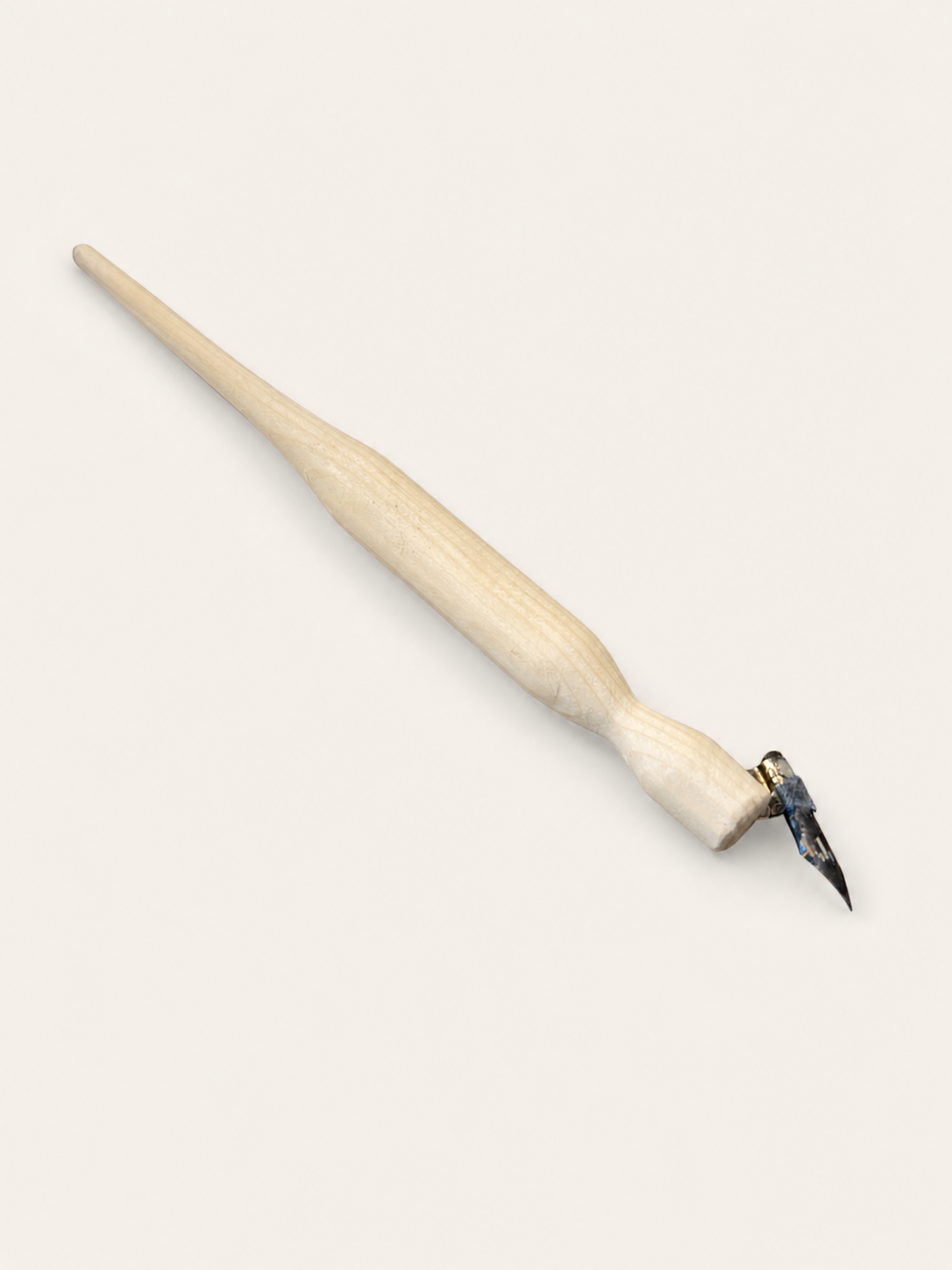 Hand-carved wooden oblique holder prototype used to test grip volume and transition