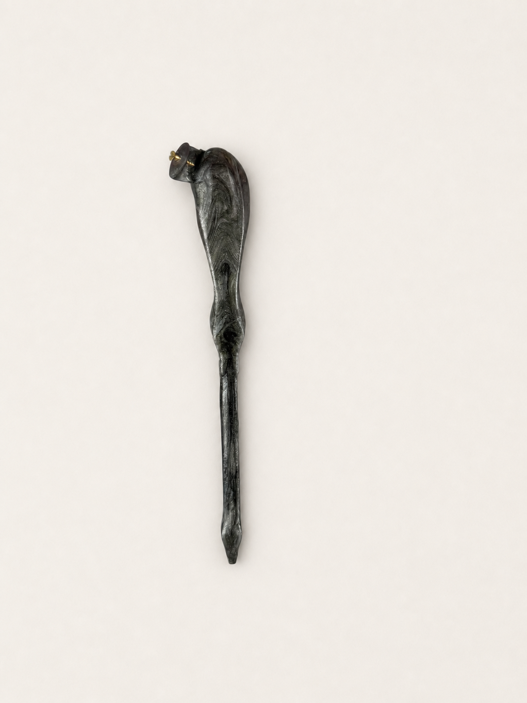 First full view of a dark marbled oblique pen holder research prototype