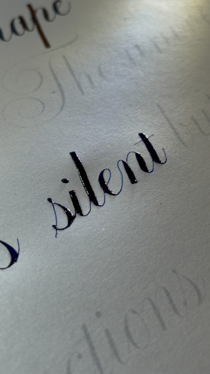 The word silent, written in Copperplate with calm rhythm and balanced spacing.